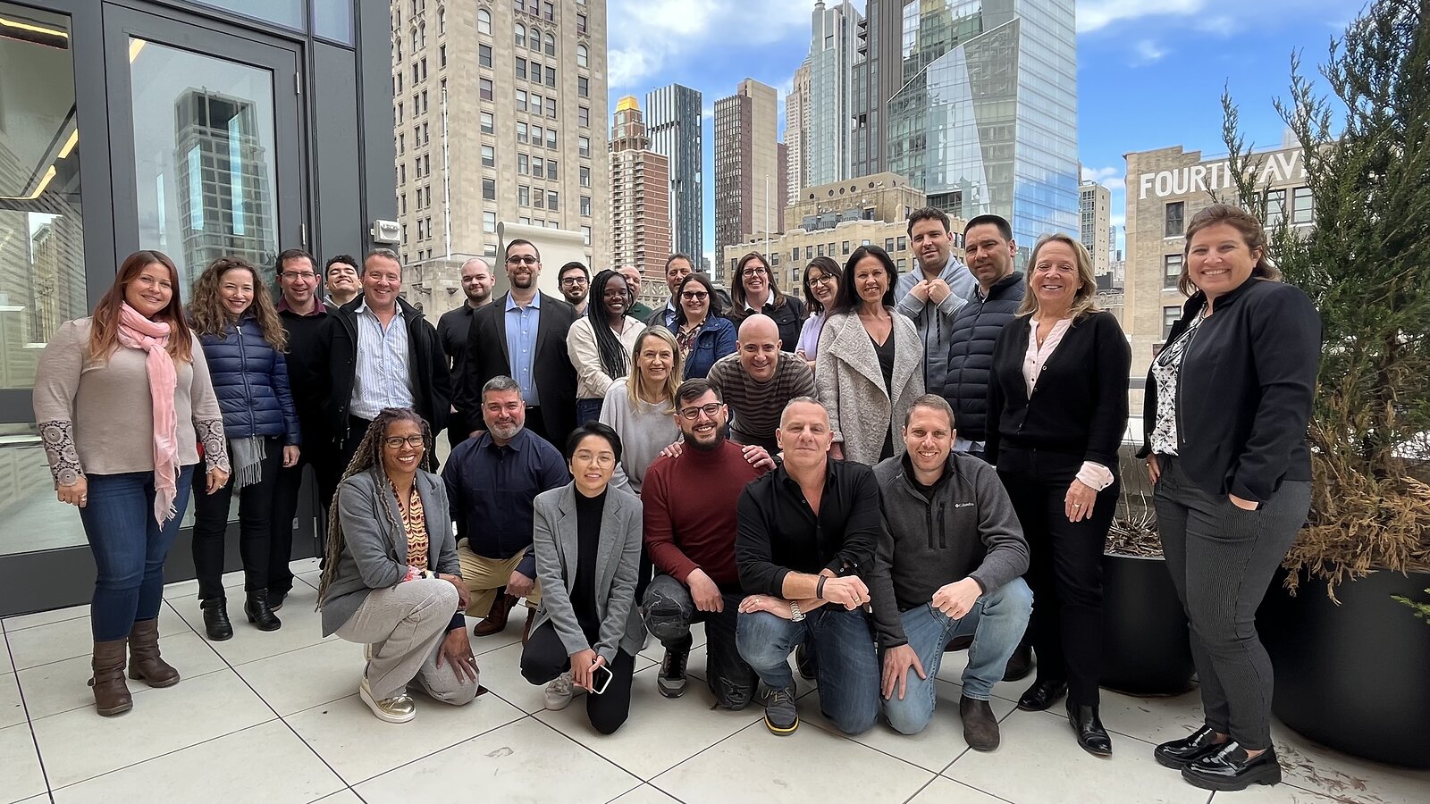 Dot Compliance's New York team posing together outdoors in a photograph released in 2022