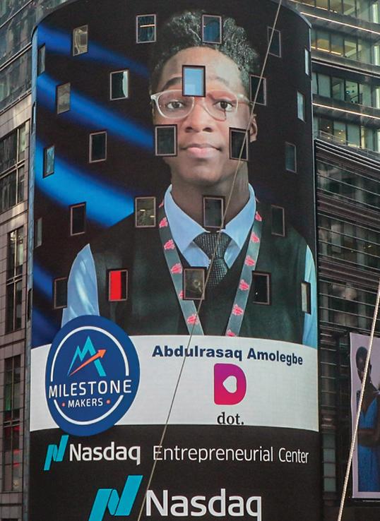 Dulra Amolegbe featured on the Nasdaq MarketSite screen in Times Square