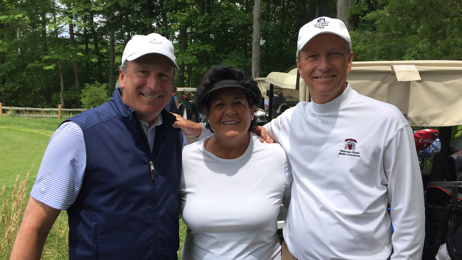 Doug Cahill with golfer Nancy Lopez and former Bowling Green teammate Brad Turner on a golf course