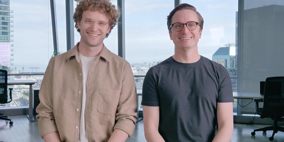 Doug Proctor and Nick Perry standing together in an office