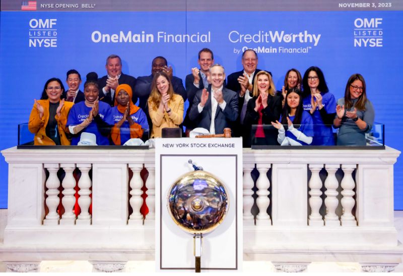 Doug Shulman applauds alongside colleagues and Credit Worthy scholarship winners at the New York Stock Exchange on November 3, 2023.