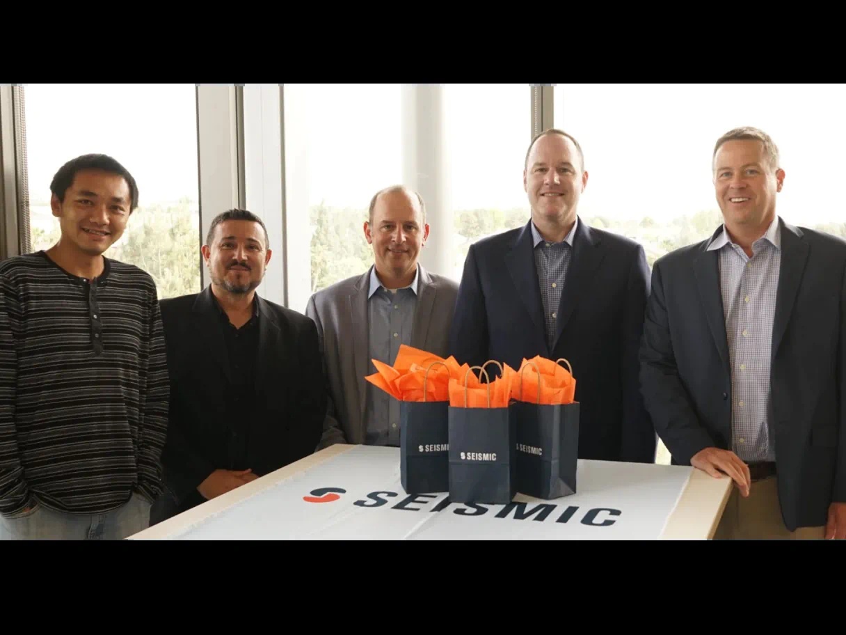 Seismic's five co-founders standing together, with Doug Winter at the far right