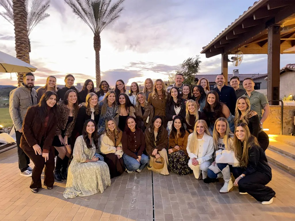 Members of the Dreamday team smiling together outdoors