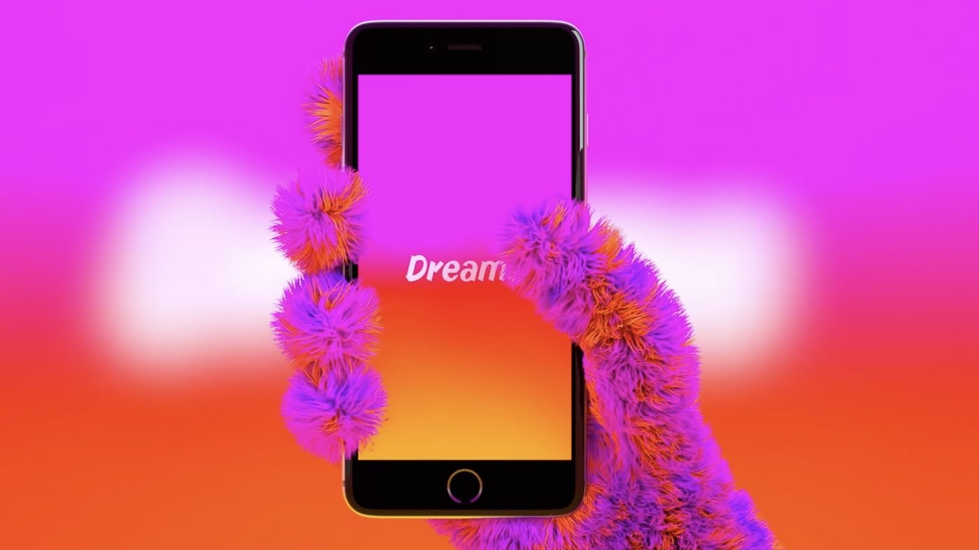 Dreams promotional image of a furry purple hand holding an upright phone