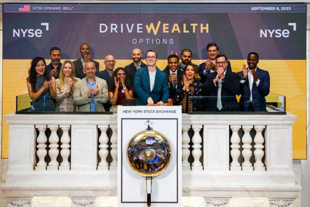 DriveWealth team applauds at the New York Stock Exchange opening bell on September 8, 2023