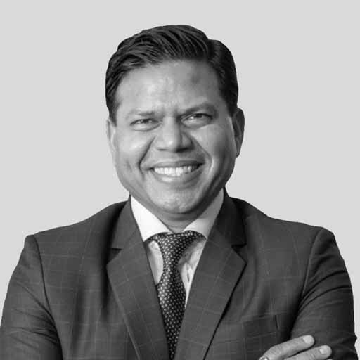 Droisys president Sanjiv Goyal in an official black-and-white portrait