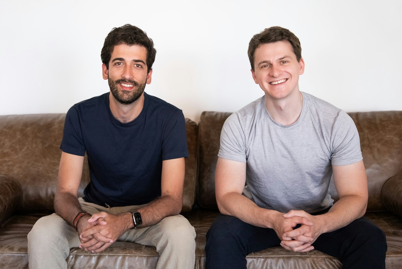 DualEntry co-founders seated together on a sofa