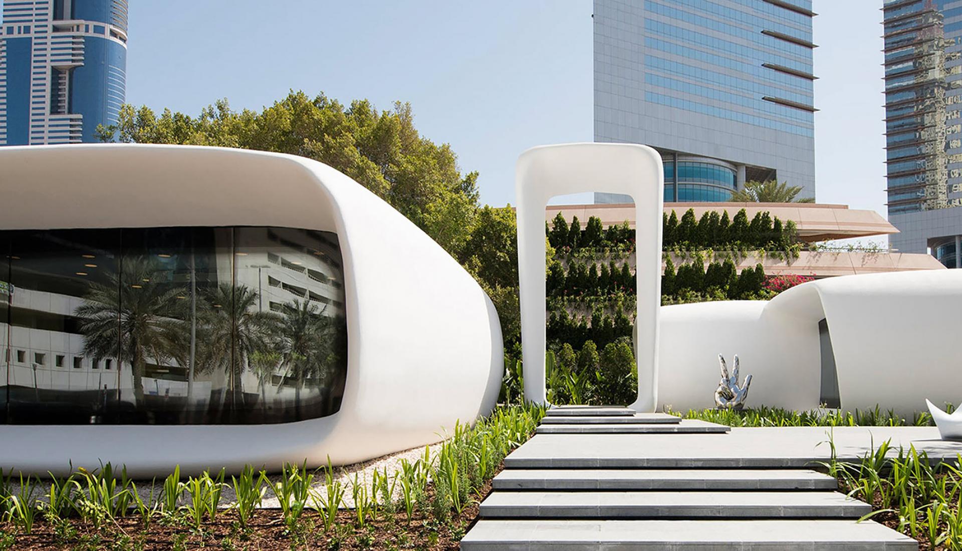 White curved modules and landscaped walkway at Dubai’s Office of the Future
