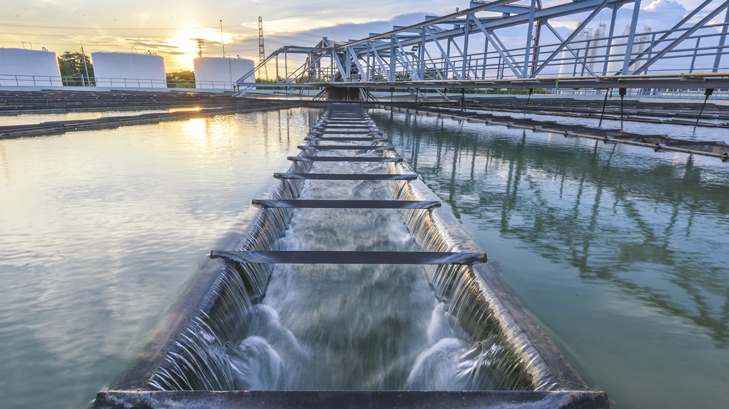 Water flowing across a treatment facility under an elevated walkway