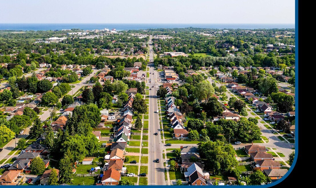 Aerial view across a residential community in Durham Region toward Lake Ontario