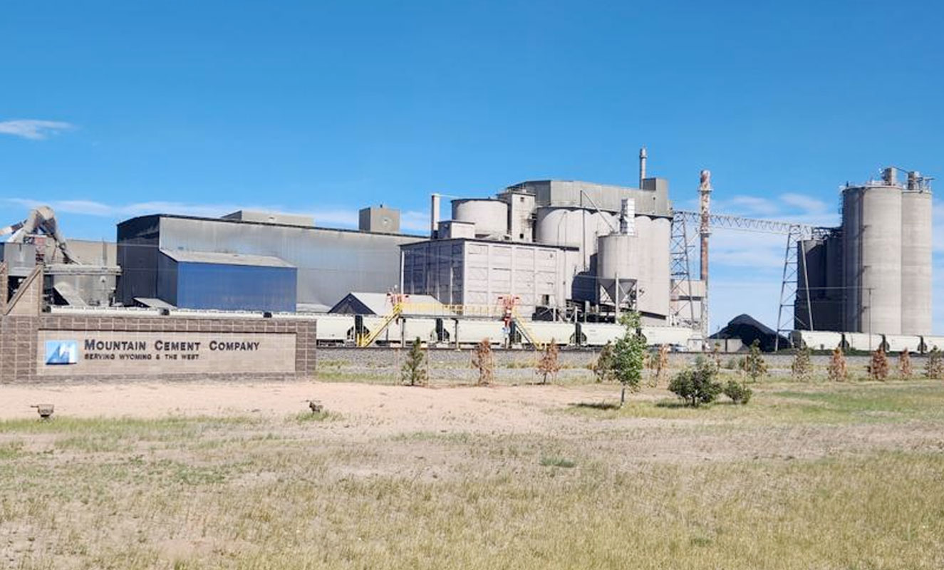 Mountain Cement plant in Laramie, Wyoming, beneath a clear blue sky