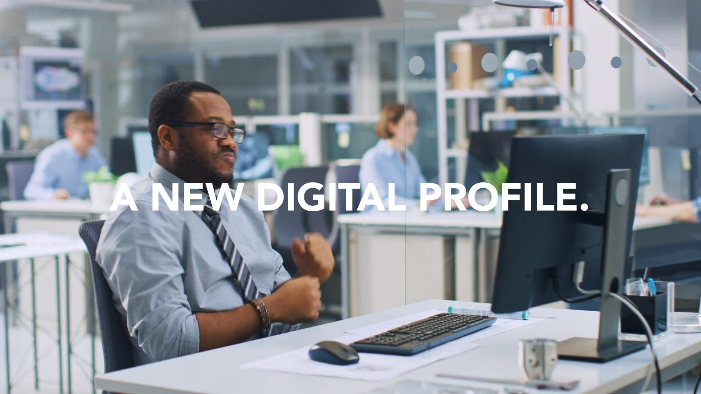 Ealixir promotional image showing a professional at a computer beneath the words A New Digital Profile