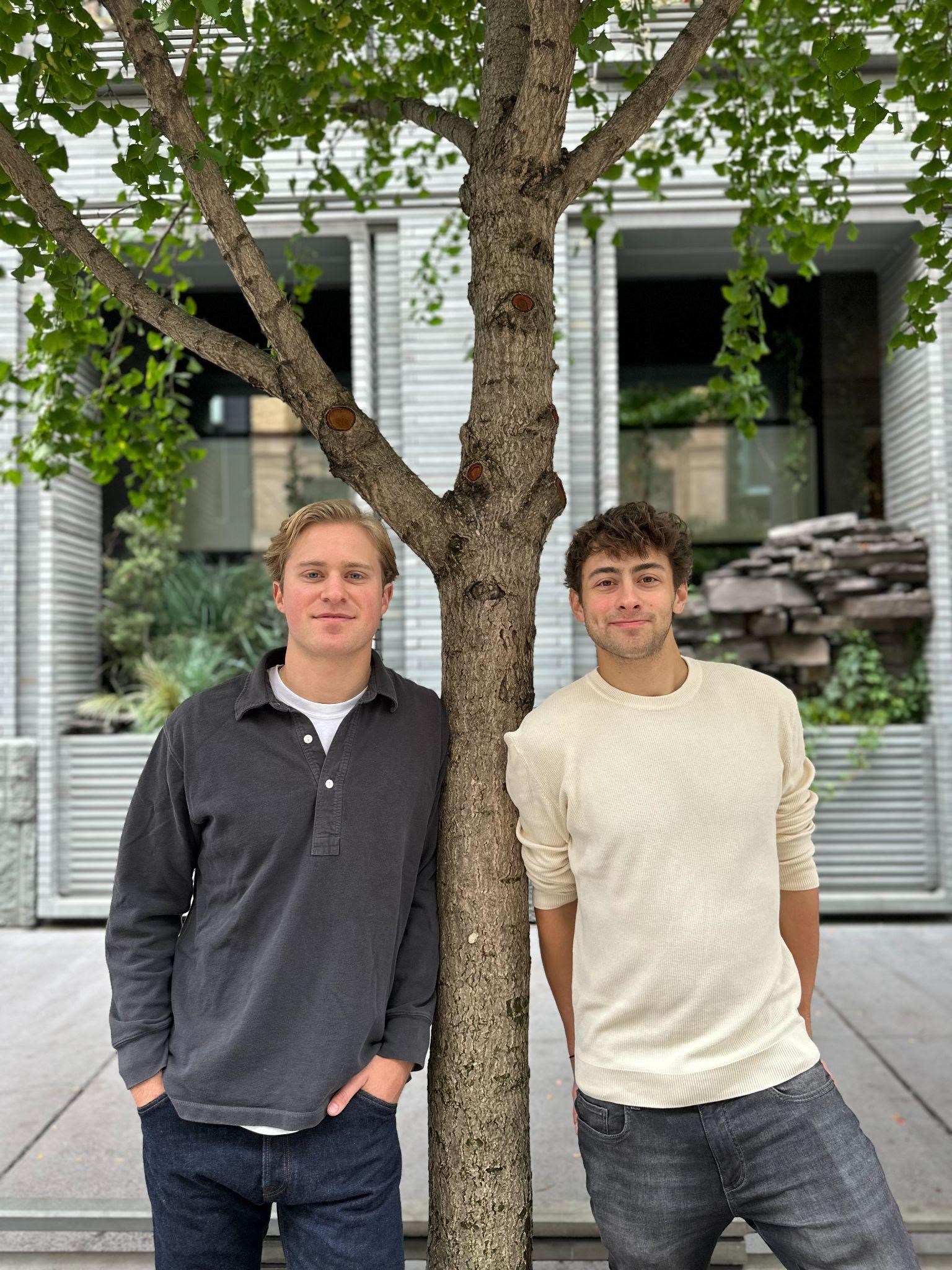 Earth Brands co-founders Peter Frelinghuysen and Misha Medvedev standing beside a tree