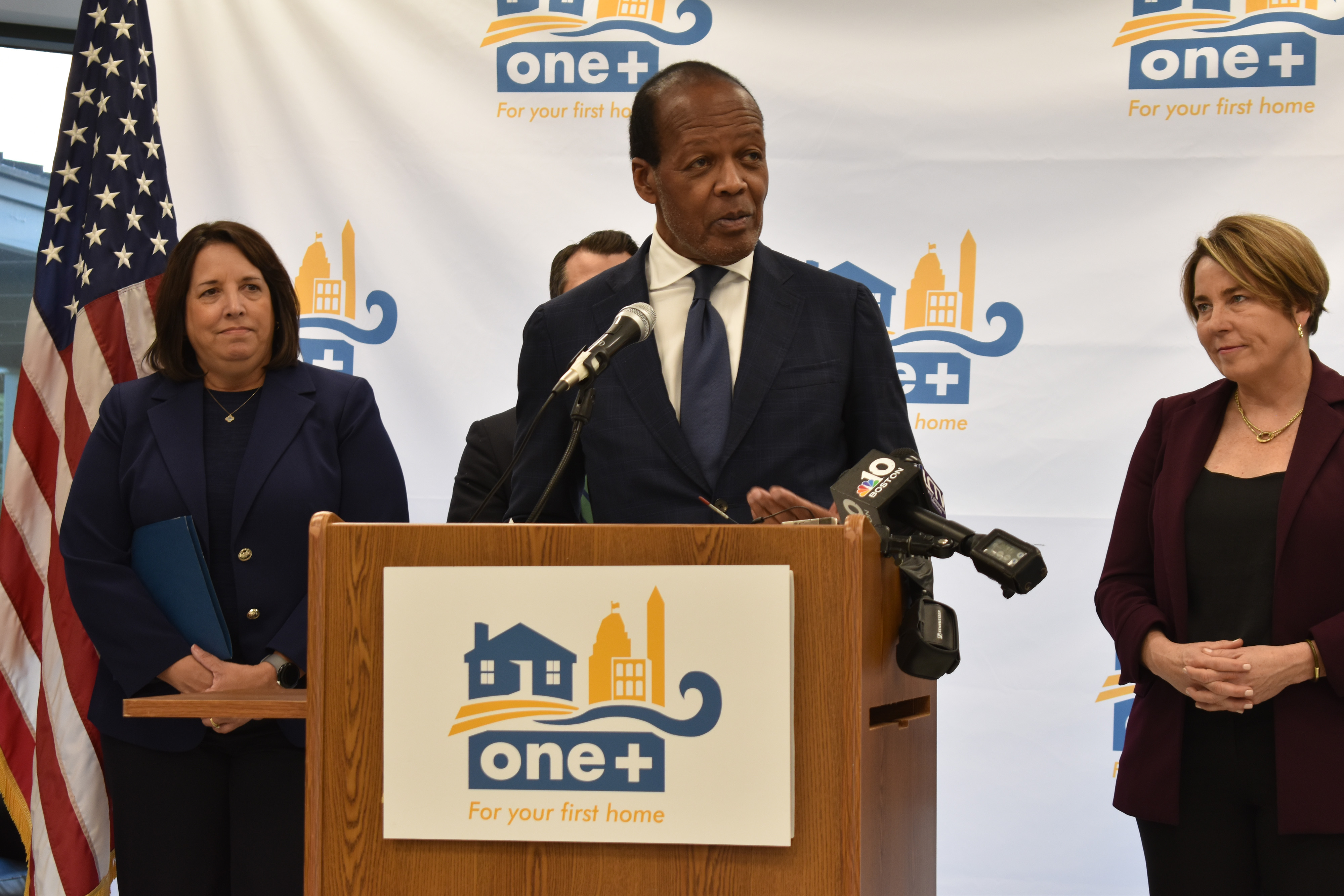 Lee Pelton speaks at the ONE+ mortgage launch, with Kim Driscoll and Maura Healey beside him