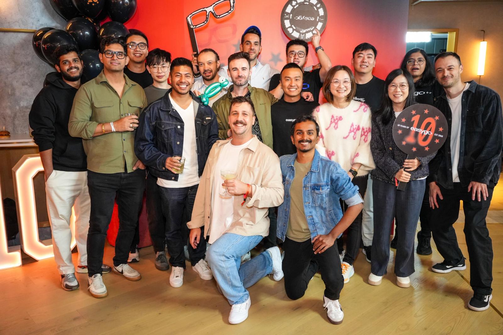 Easygo engineering colleagues posing together at a company celebration