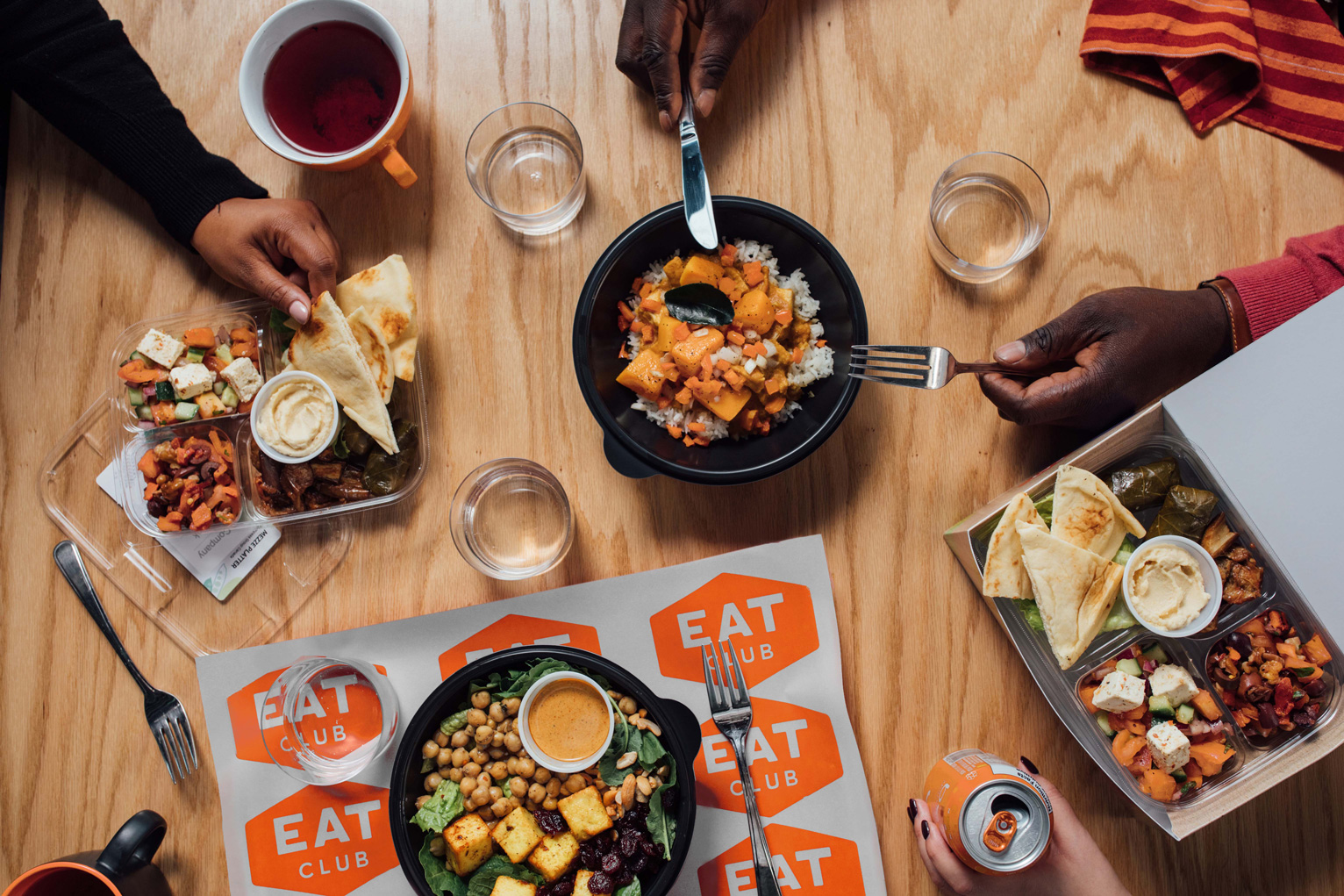 EAT Club meals spread across a communal table