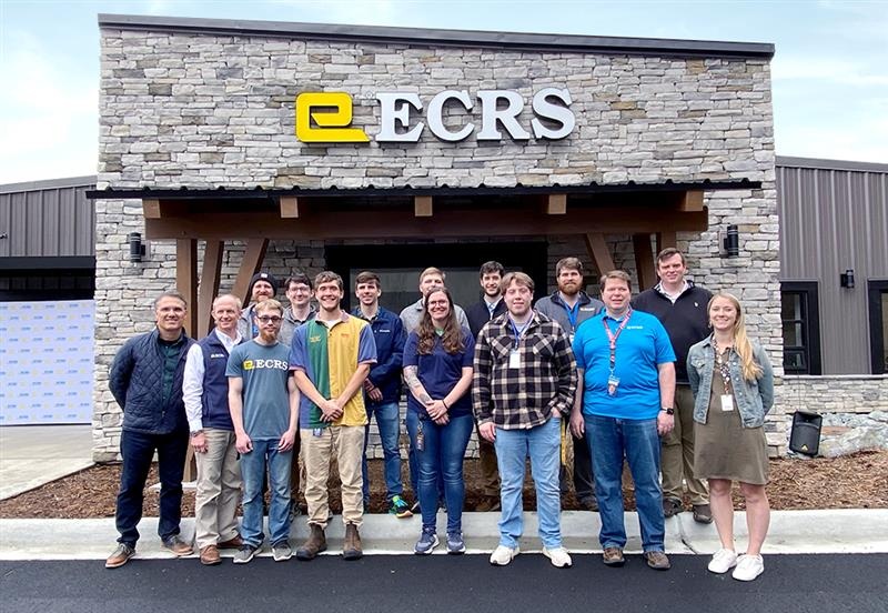 ECRS team gathered outside the deployment center at its March 2023 opening
