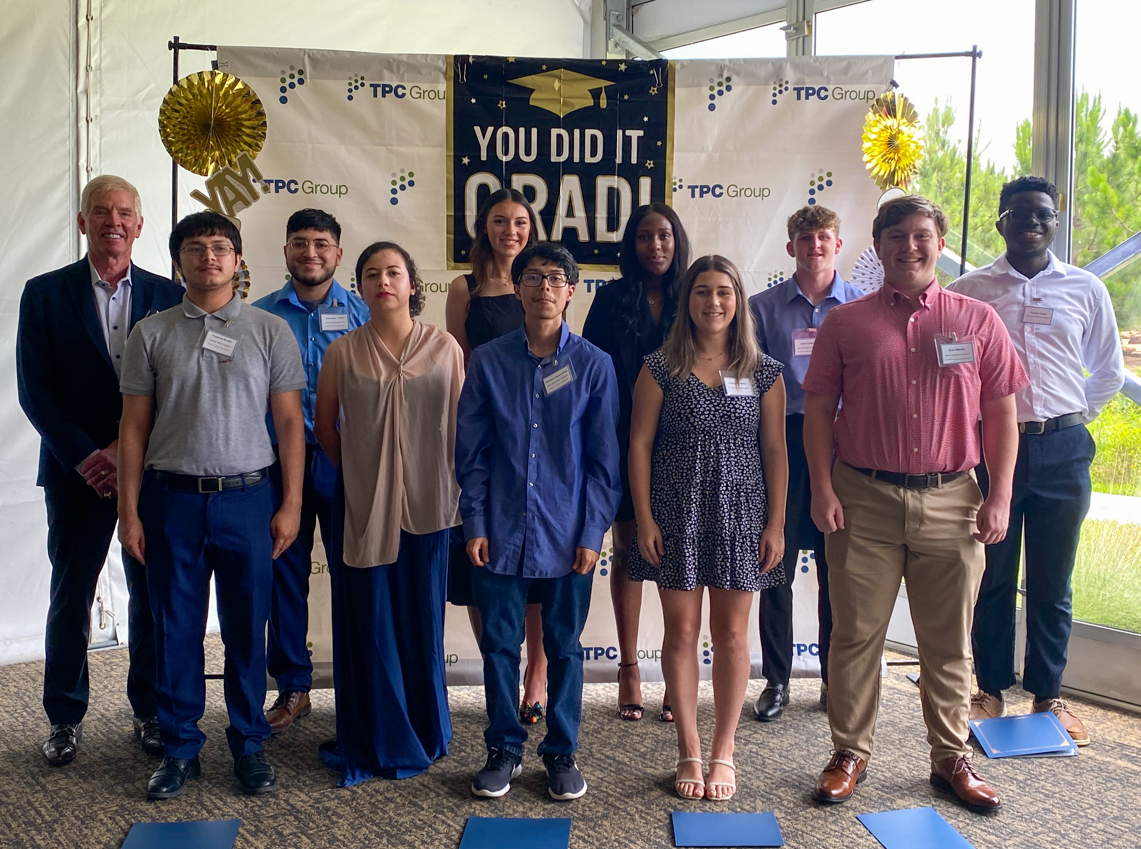 Ed Dineen, at far left, standing with TPC Group's 2024 scholarship recipients