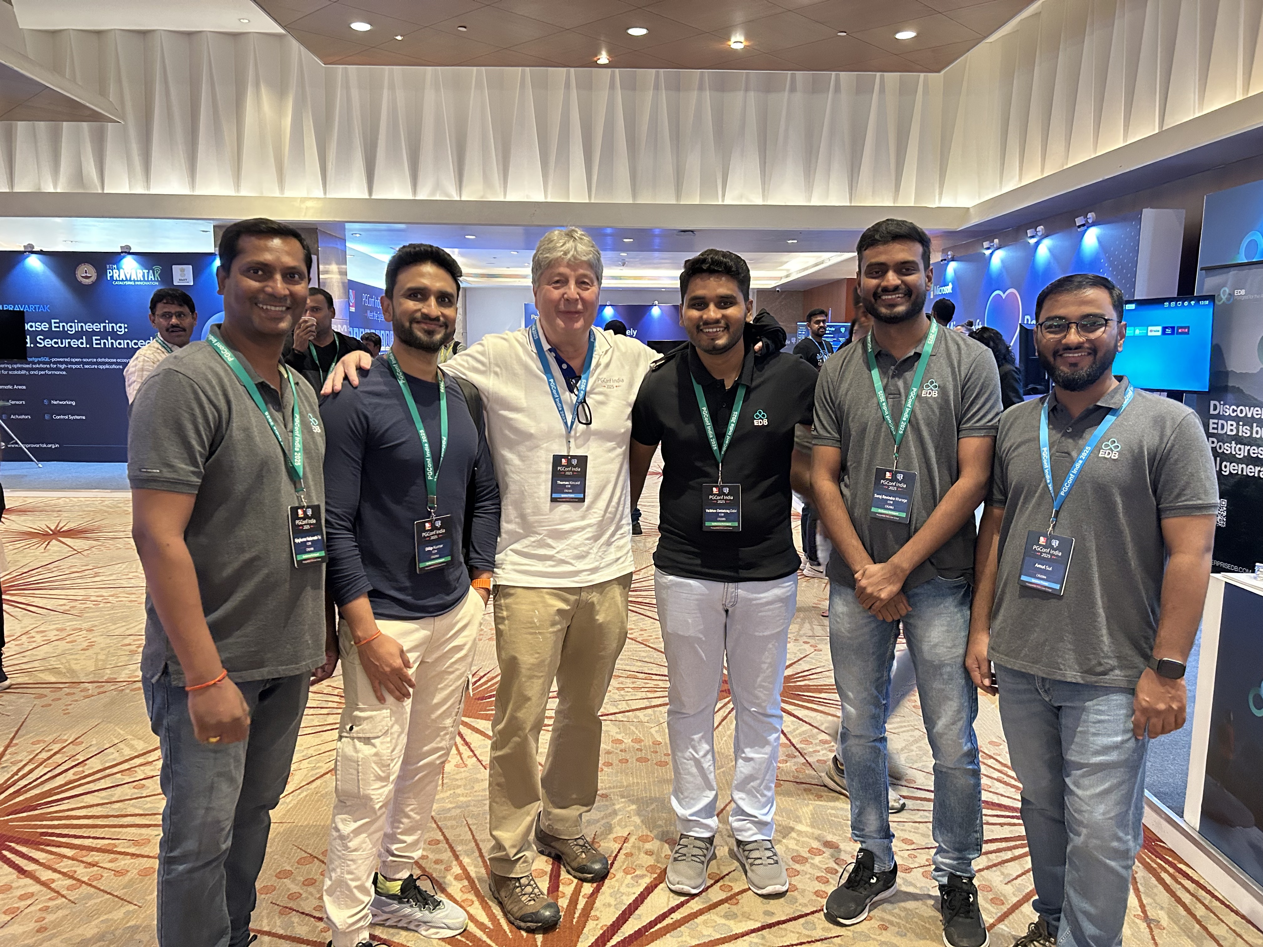 Six EDB colleagues standing together at PGConf India 2025