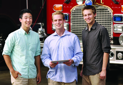 Eddie Zhou, Charlie Jacobson and James Siderius standing in front of a fire engine during their Princeton FireStop project