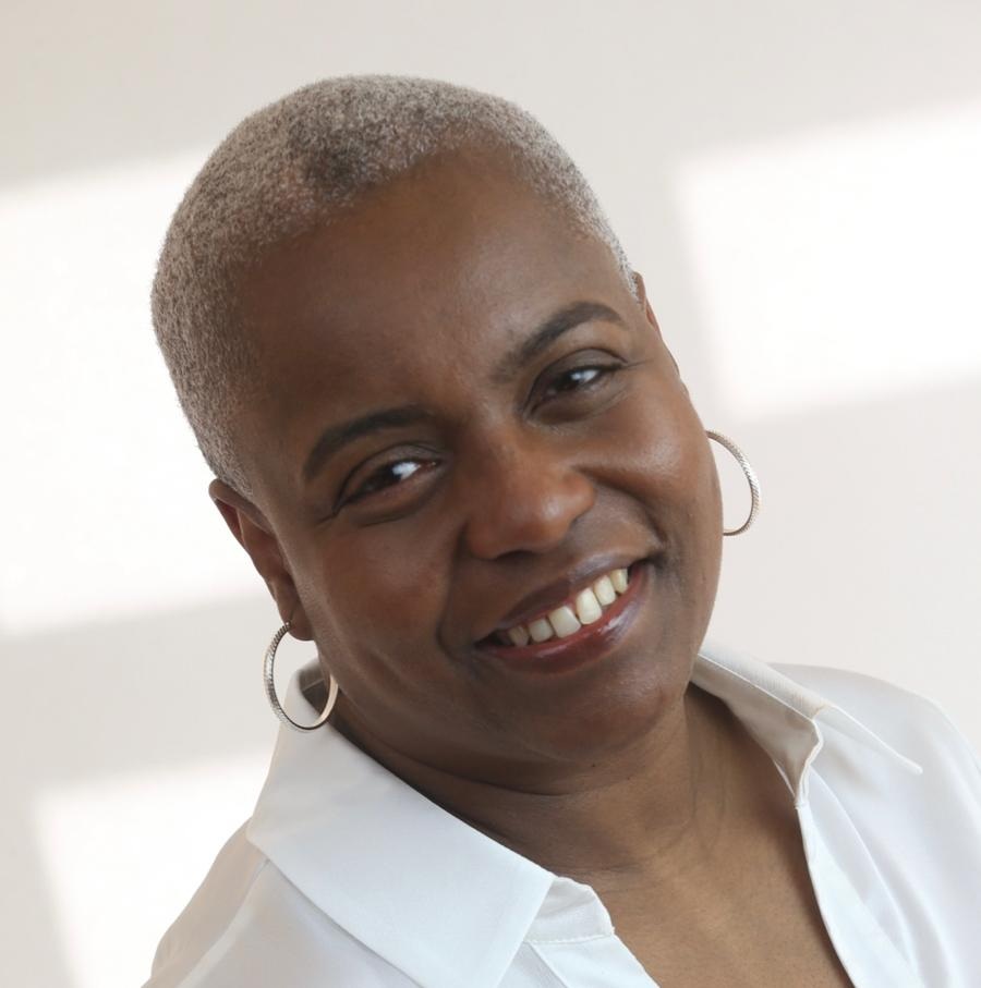 Frances Trought, founder of Everything D&I, smiling in a white shirt