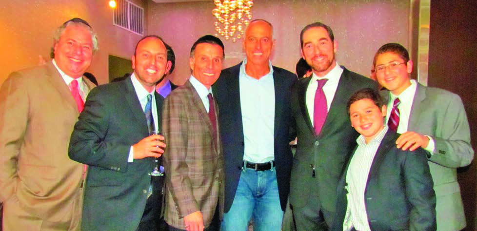 Edmond Harary, second from left, with members of the Shaare Shalom community and Rabbi Joseph Dweck