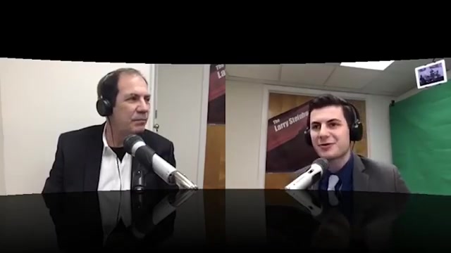 Ed Barone speaking into a studio microphone during RentRedi's first live interview
