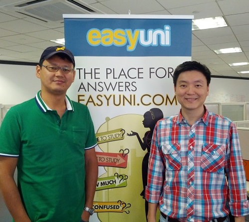 EasyUni co-founder Nurbek Jusupov on the left and Edwin Tay on the right, standing beside an EasyUni banner