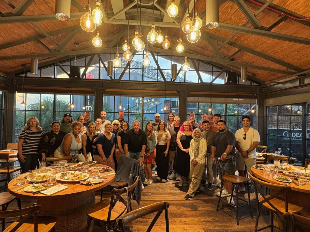 Vecteezy coworkers gathered for dinner at Wine Bar George during the 2025 Orlando company meeting