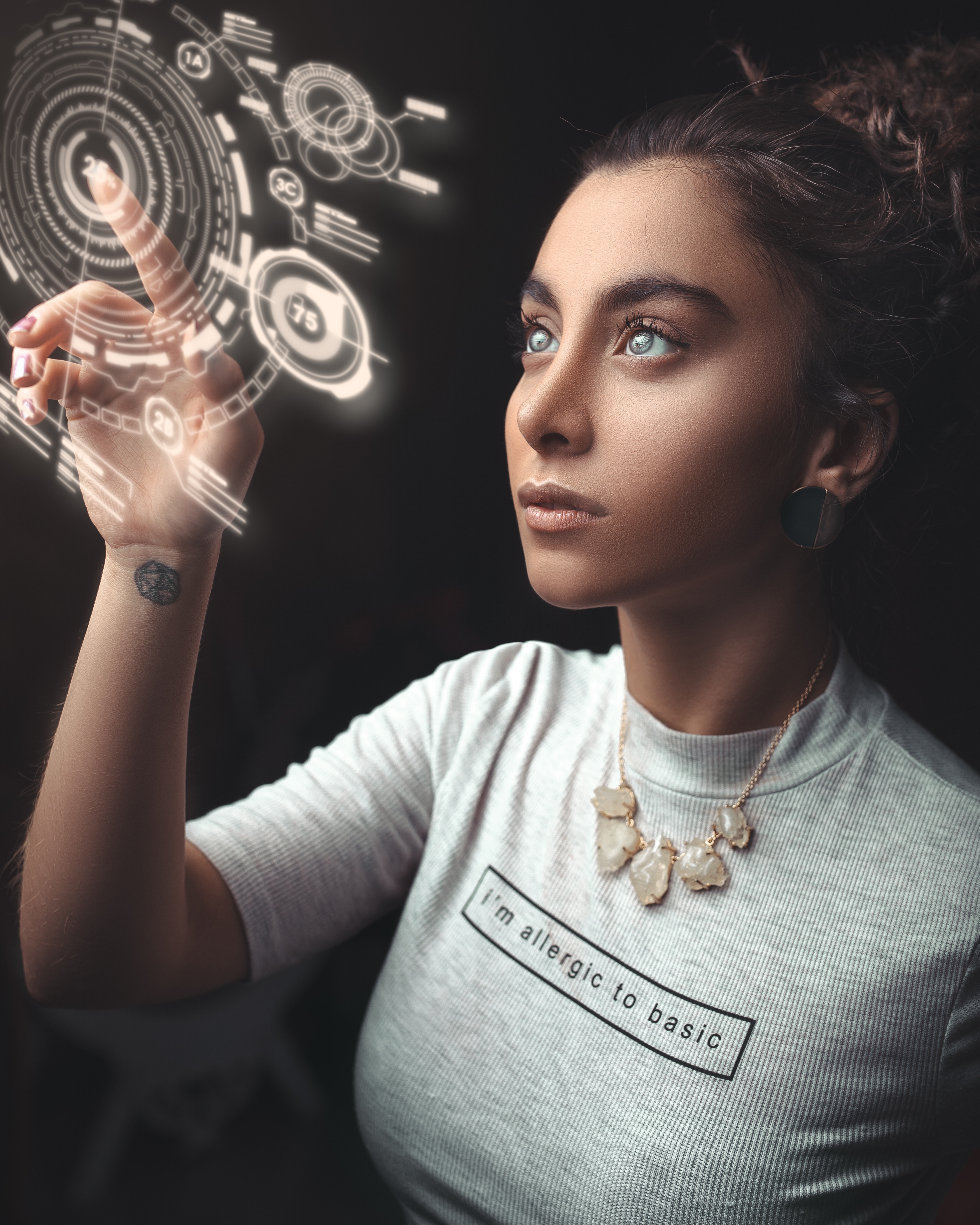 Illustrative photograph of a woman reaching toward a digitally overlaid interface
