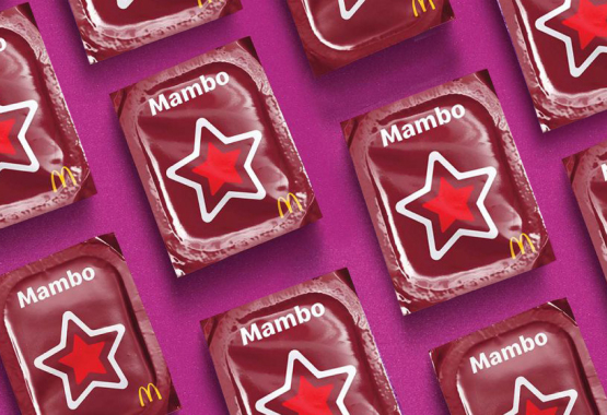 McDonald's Mambo Sauce packets arranged on a magenta background