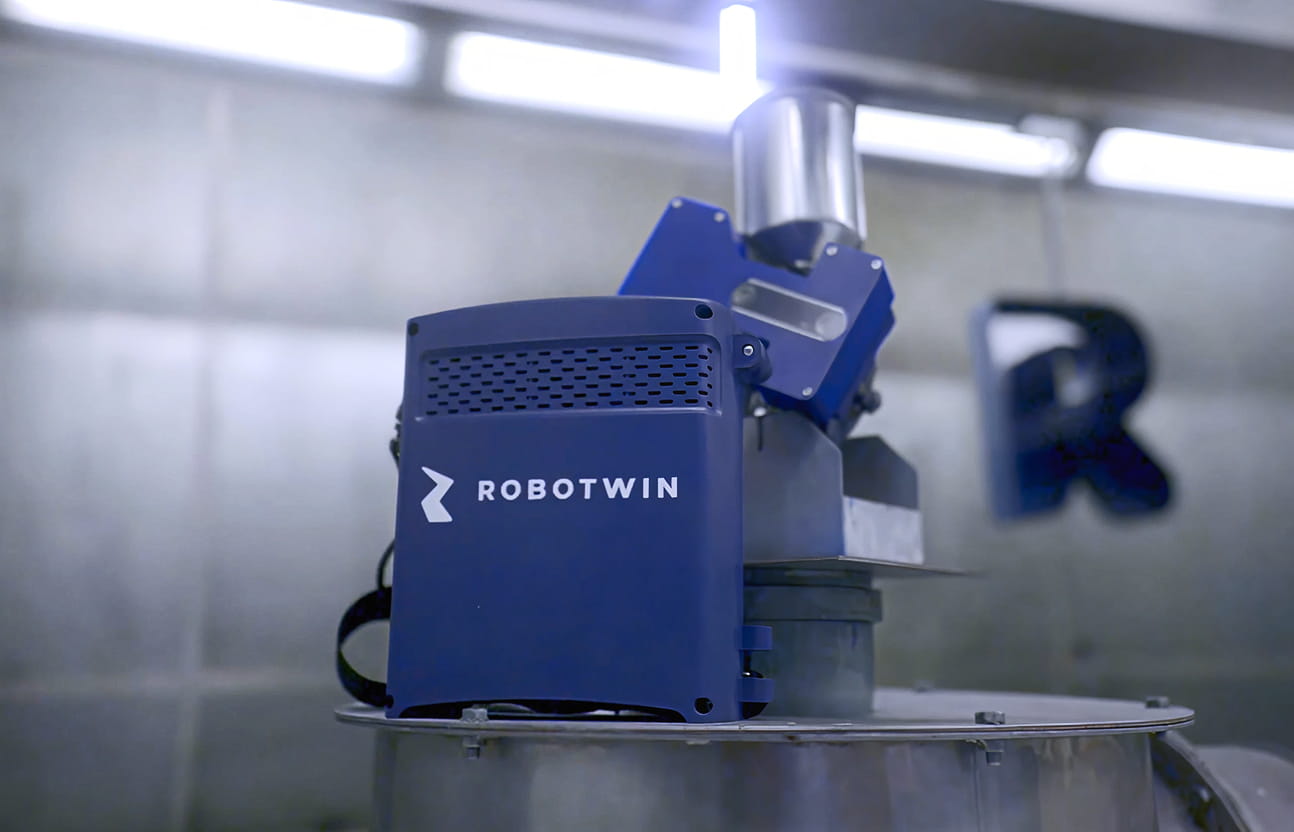 Close-up of blue RoboTwin equipment in an industrial setting