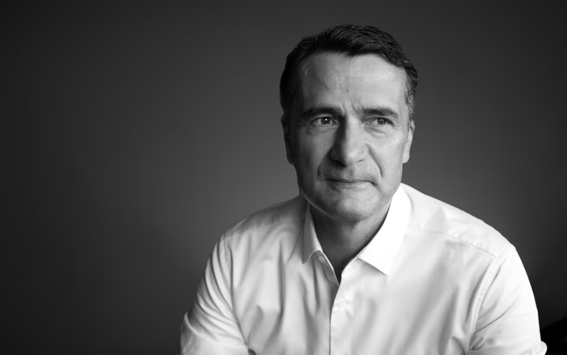 Black-and-white portrait of Ekin founder Akif Ekin