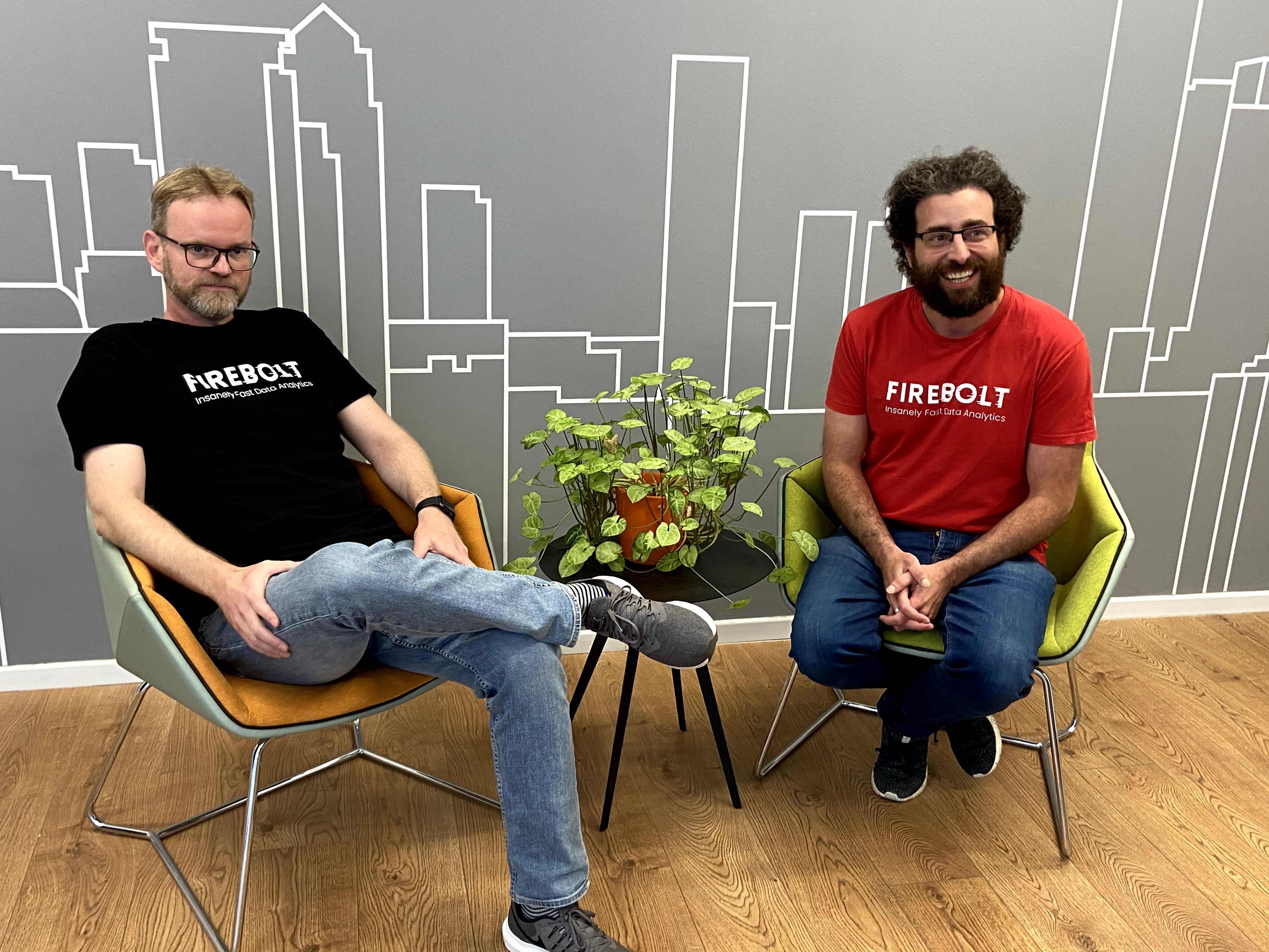 Saar Bitner seated at left and Eldad Farkash seated at right, wearing Firebolt shirts