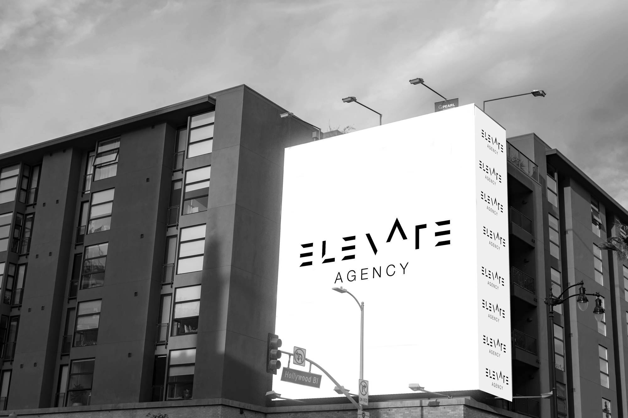 Black-and-white Elevate Agency billboard concept on Hollywood Boulevard