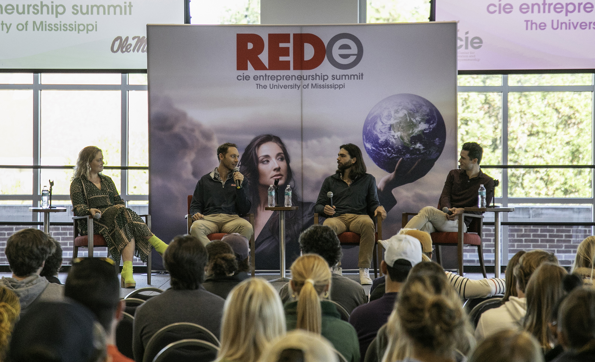 Curtsy co-founders Clara Agnes Ault, William Ault, Eli Allen and David Oates speaking onstage at the 2023 REDe Entrepreneurship Summit