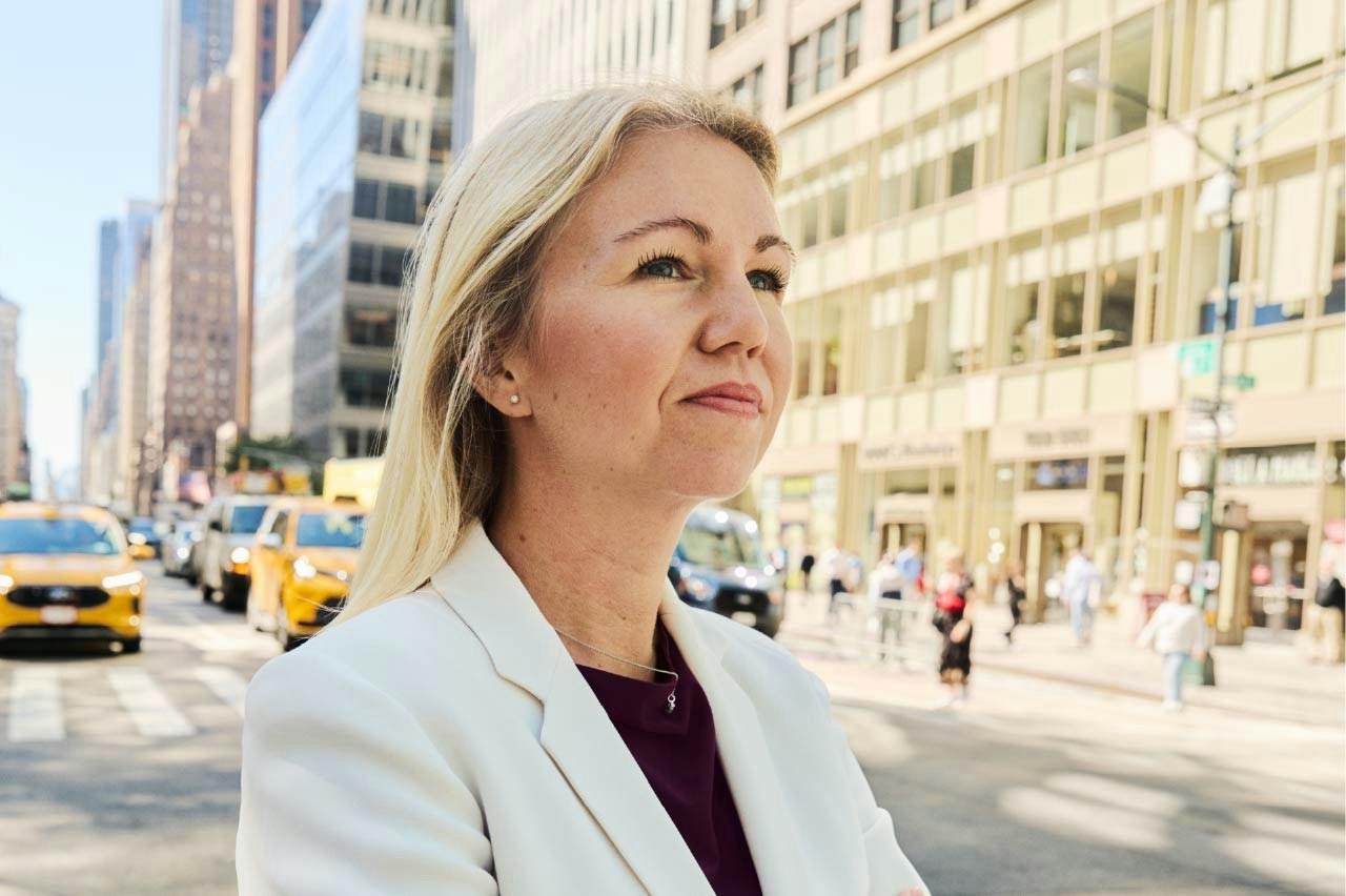 Elina Scherwitzl standing on a sunny New York street