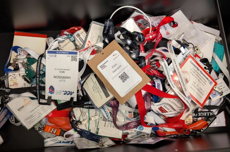 Eliot Harrison’s collection of conference badges and tangled lanyards