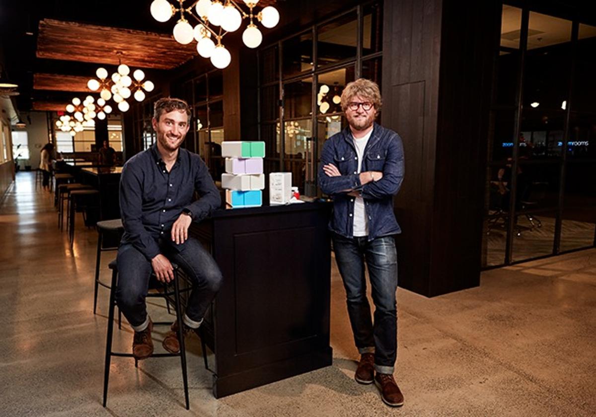 Elliot Cohen seated on the left and TJ Parker standing on the right in the PillPack office