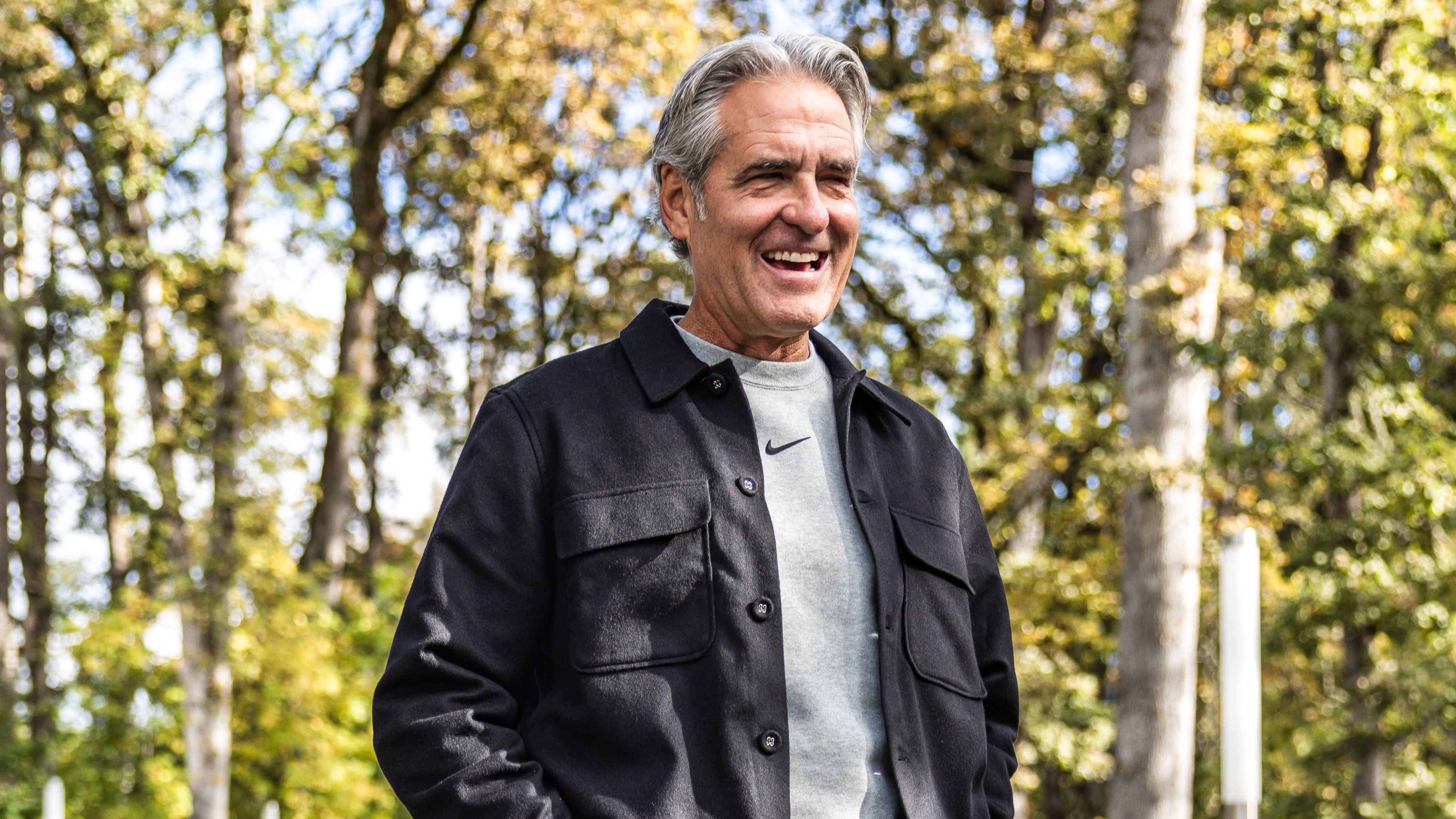 Elliott Hill smiling outdoors during his return to Nike in October 2024