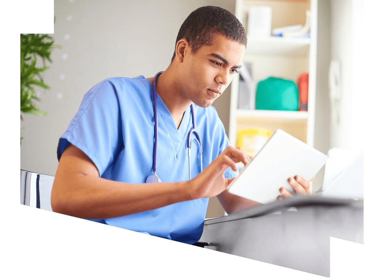 Elsevier promotional photograph of a clinician consulting a tablet