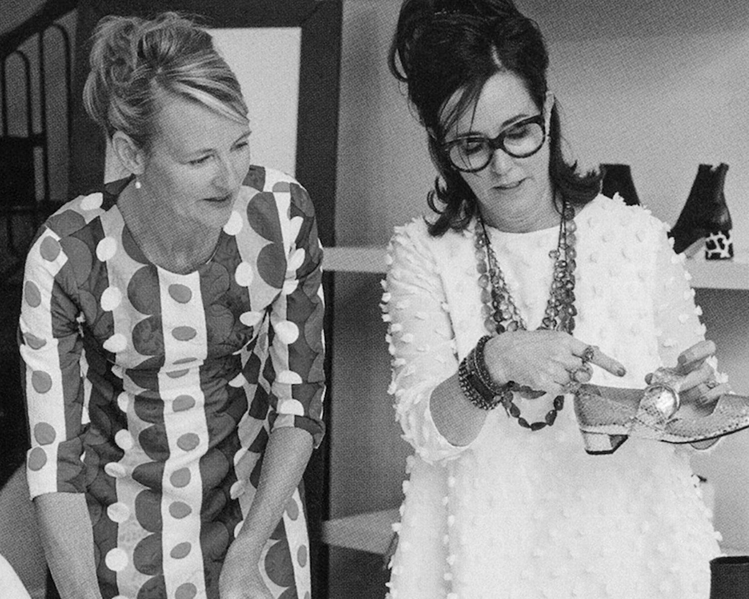 Elyce Arons and Kate Spade examining a shoe together