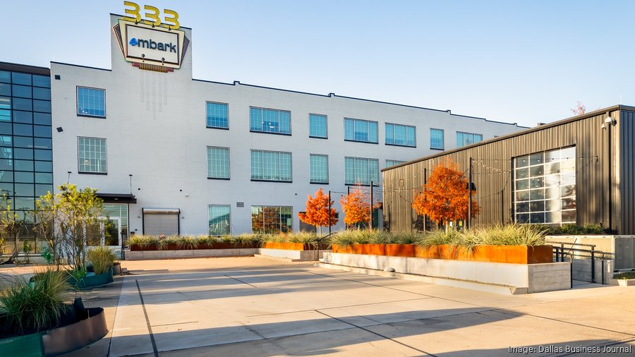Exterior of Embark’s Dallas headquarters, with a landscaped courtyard and adjoining annex