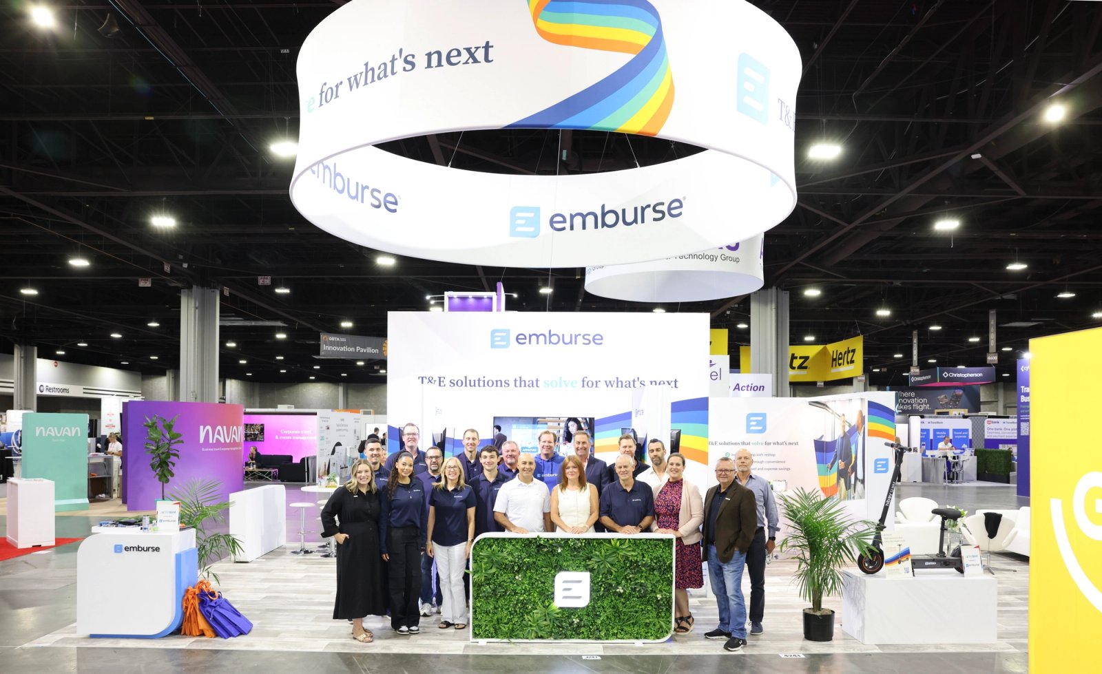 People discussing work in the photograph used on Emburse’s careers page