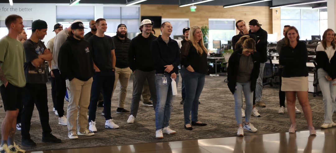 Emerge employees gathered together in the company office