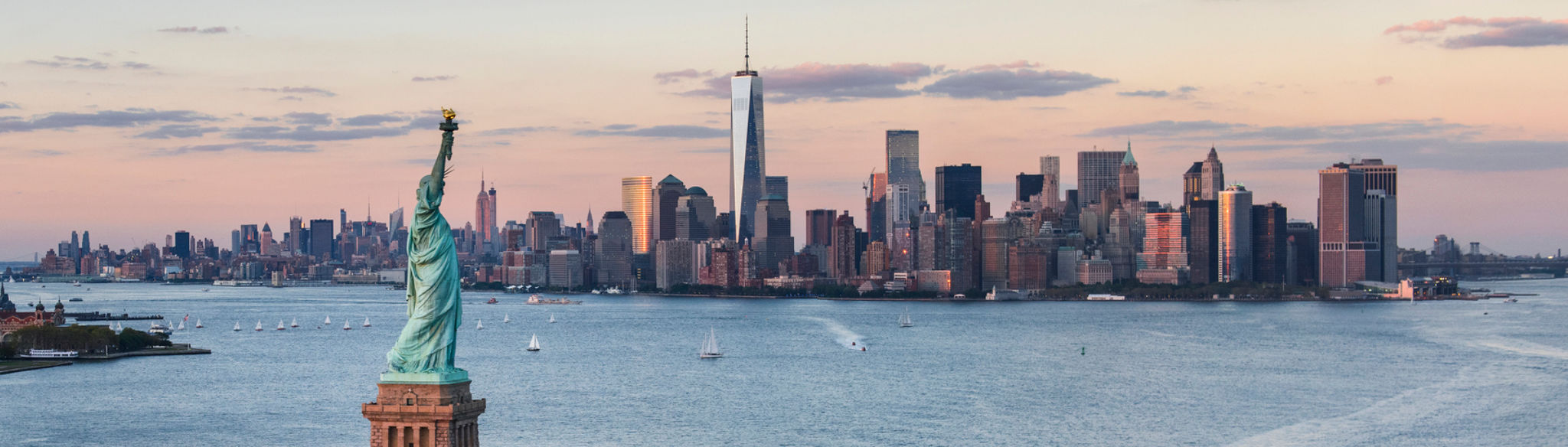 The Statue of Liberty and Lower Manhattan seen across New York Harbor