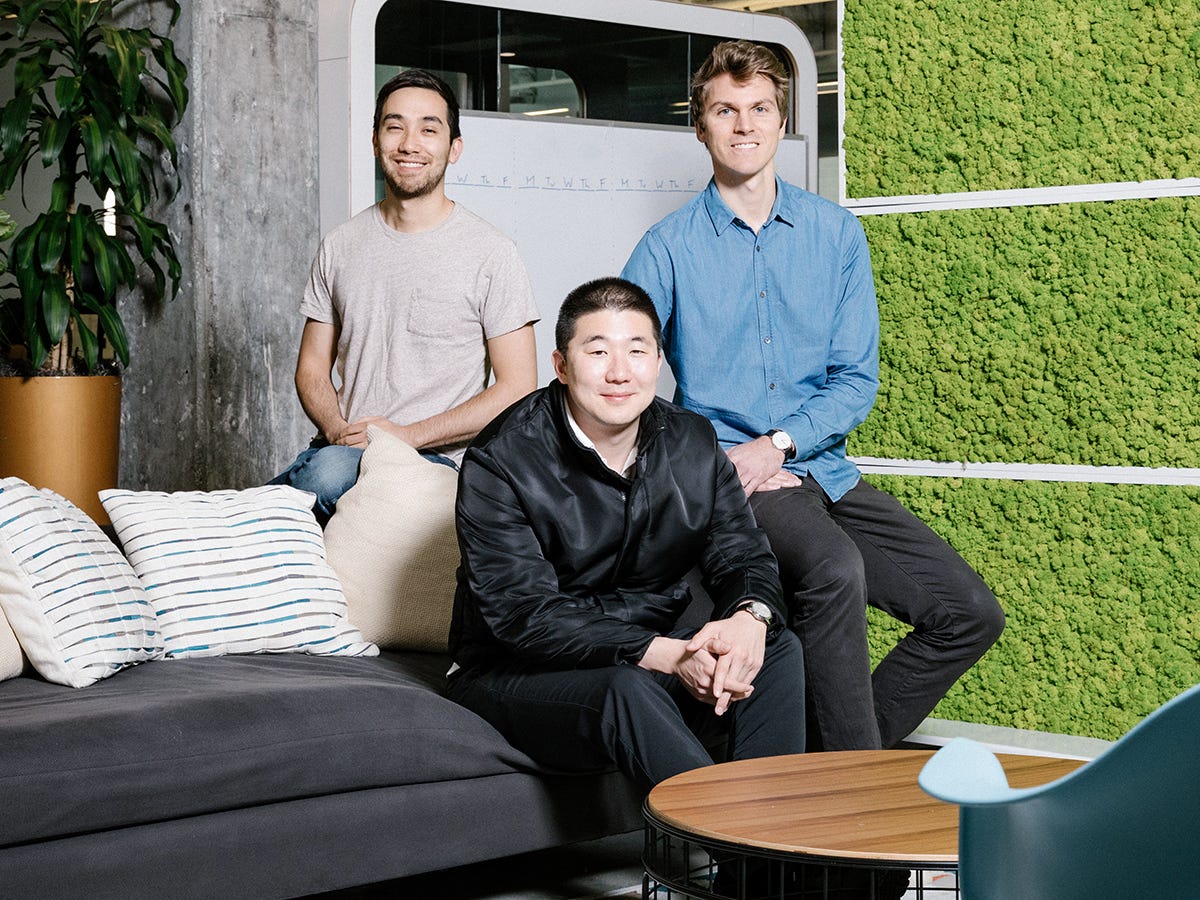Airtable's three co-founders together in an office