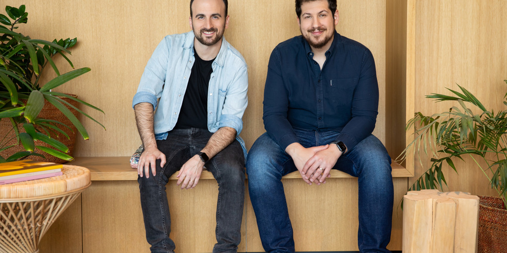 Empathy co-founders Ron Gura and Yonatan Bergman seated in an office