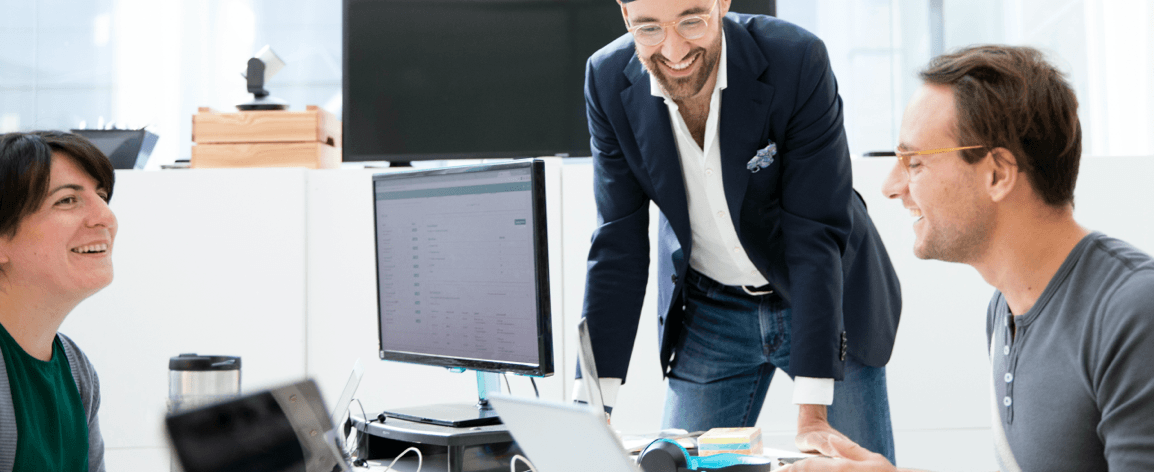 Members of Empatica’s team working together in an office