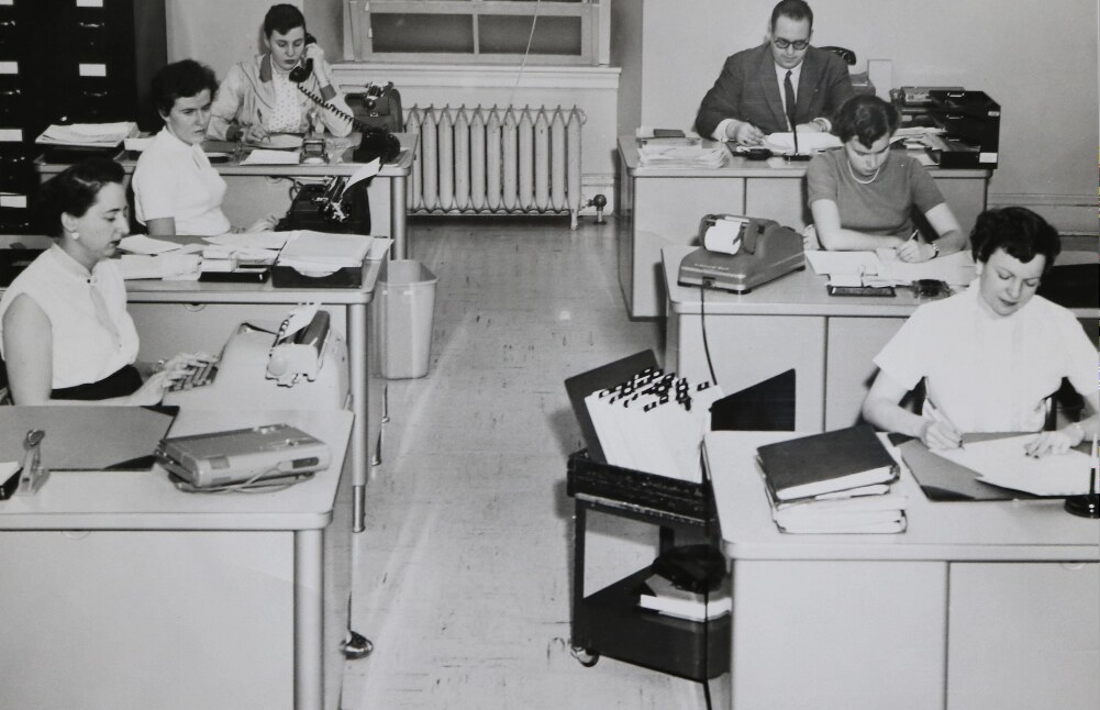 Archival photograph of Empire Life employees working in an office